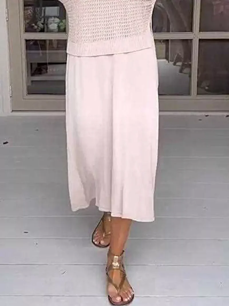 Plus size 2-delige set bestaande uit een opgemaakt gebreid vestje en jurk met oversized pasvorm.