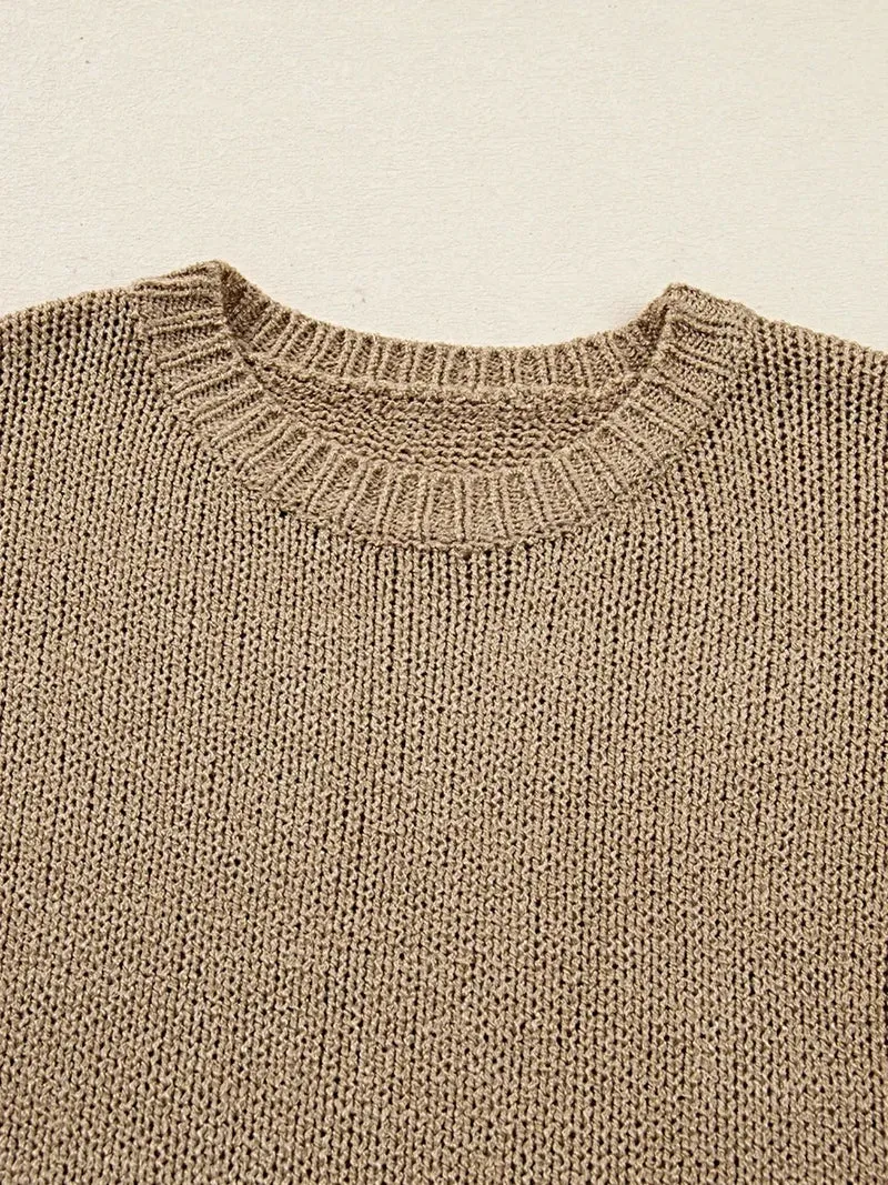 Oversized sweaterjurk - losvallend gebreid ontwerp met verlaagde schouders en een relaxte pasvorm.