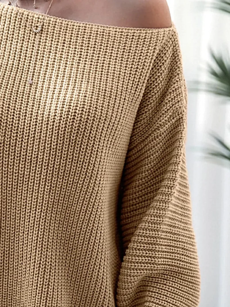 Dames mini-trui-jurk van ribgebreid materiaal met lange mouwen, gemaakt van licht elastisch acrylbreisel.