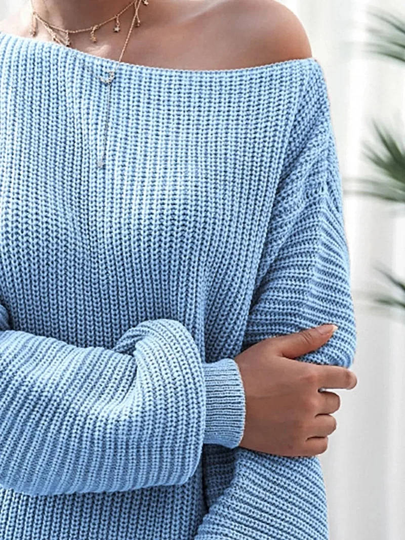 Dames mini-trui-jurk van ribgebreid materiaal met lange mouwen, gemaakt van licht elastisch acrylbreisel.