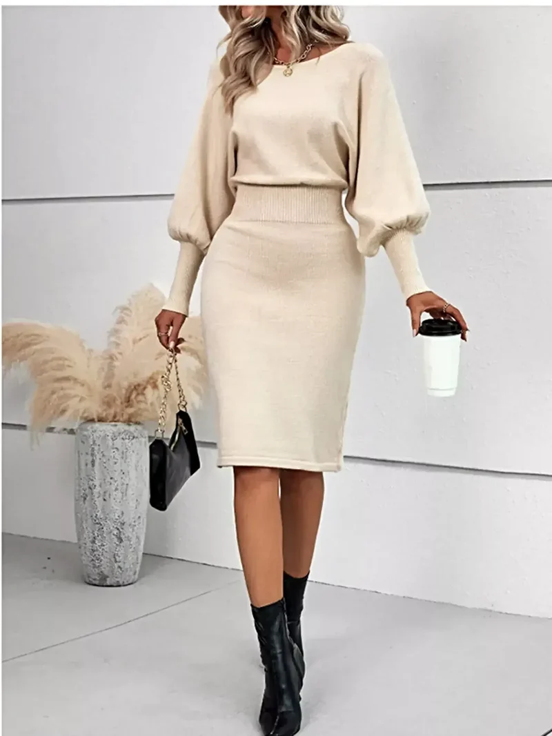 Geribbelde bodycon sweaterjurk met lantaarnmouwen, gemaakt van elastisch breisel en met een elegante midi-lengte.