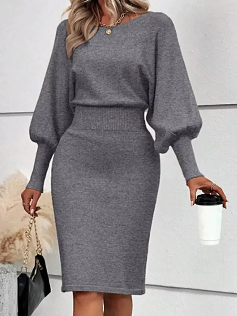 Geribbelde bodycon sweaterjurk met lantaarnmouwen, gemaakt van elastisch breisel en met een elegante midi-lengte.