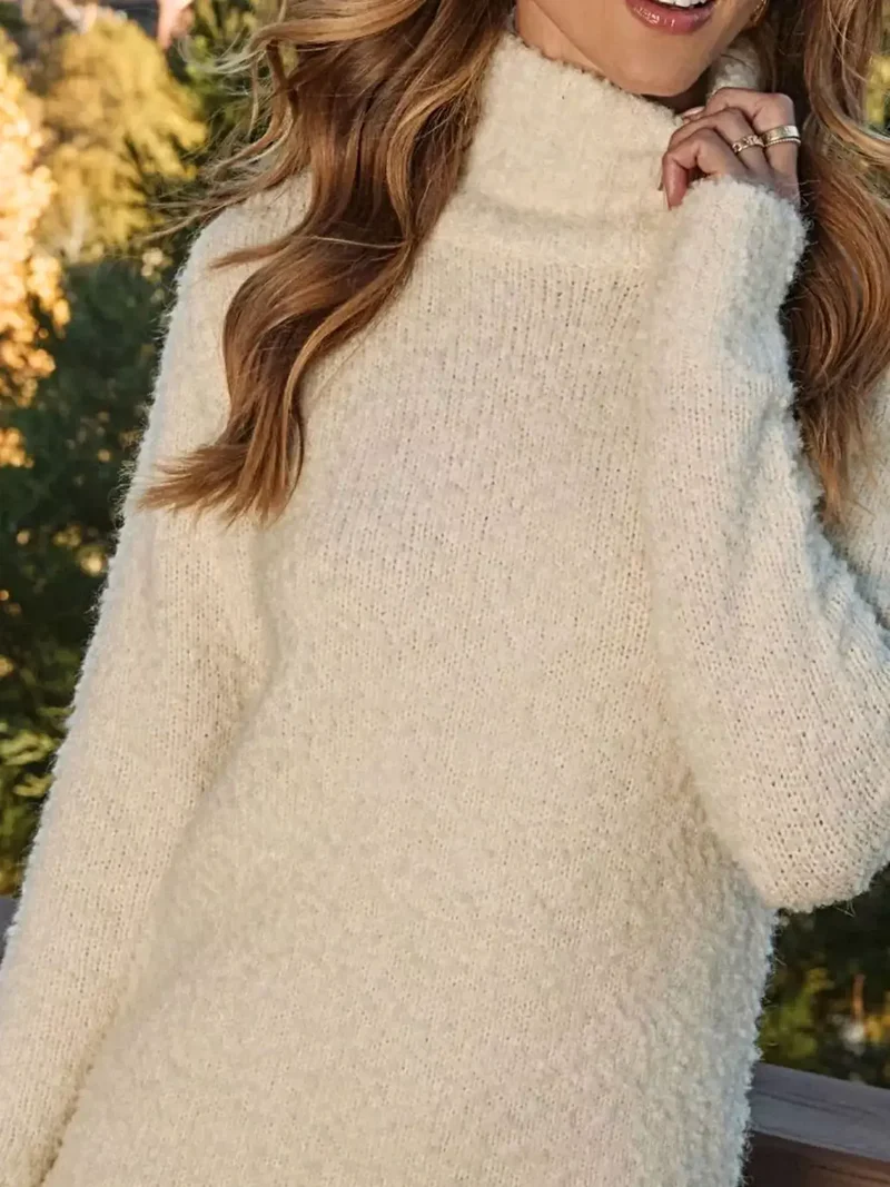 Elegante sweaterjurk met franjes, col, lange mouwen en zachte, elastische gebreide stof.