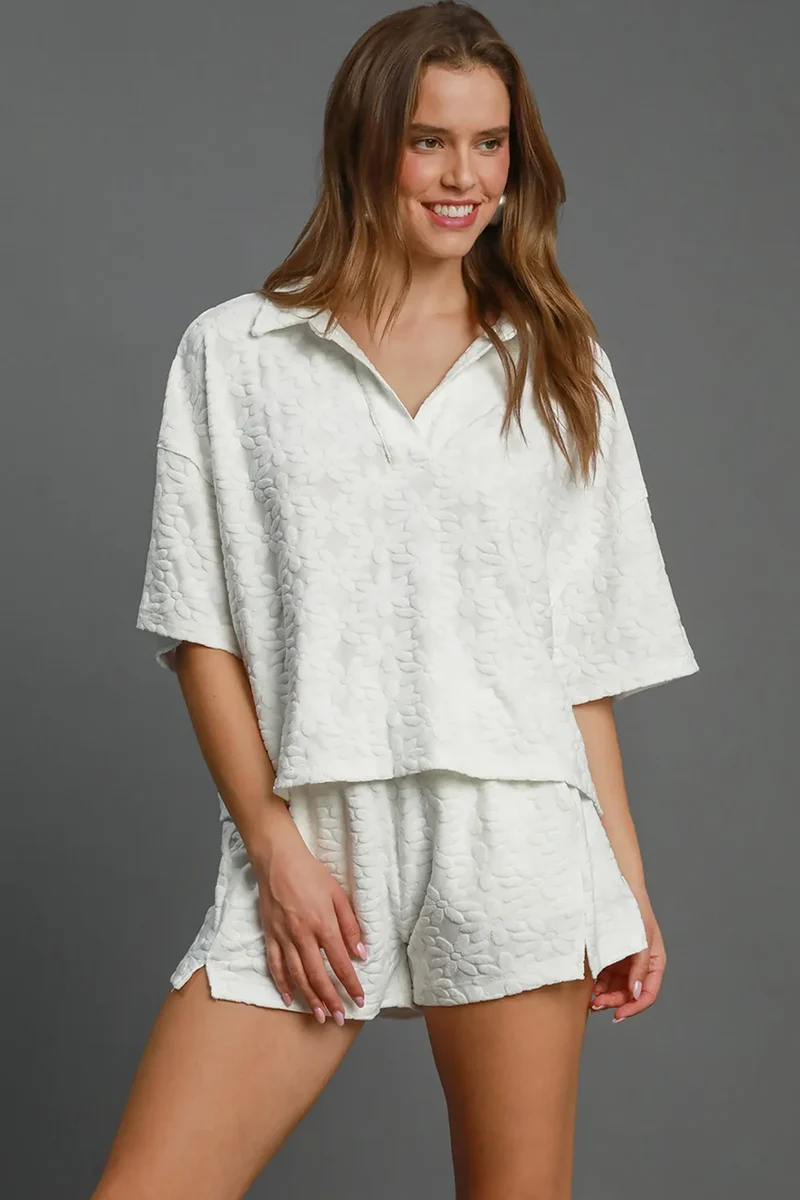 Umgee shorts met bloemenprint, elastische tailleband en jacquardstof, inclusief zakken.