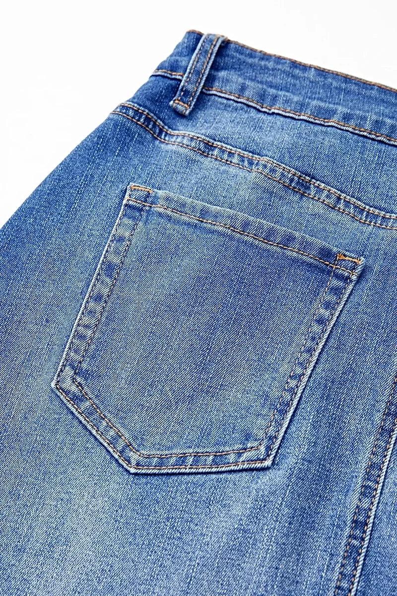 Luxe denim minirok met wikkelmodel, gekruiste taille en zakken - een trendy stijl