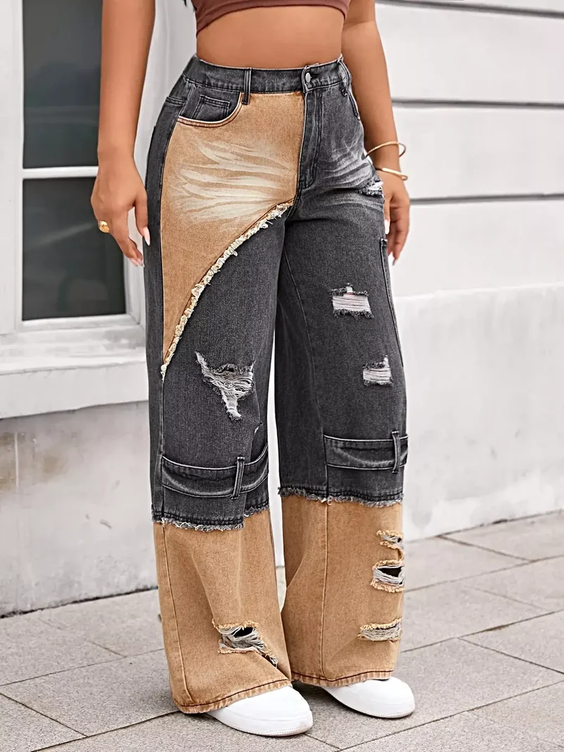 Stijlvolle tweekleurige jeans met scheuren en wijde pijpen, een verwassen look en zakken.