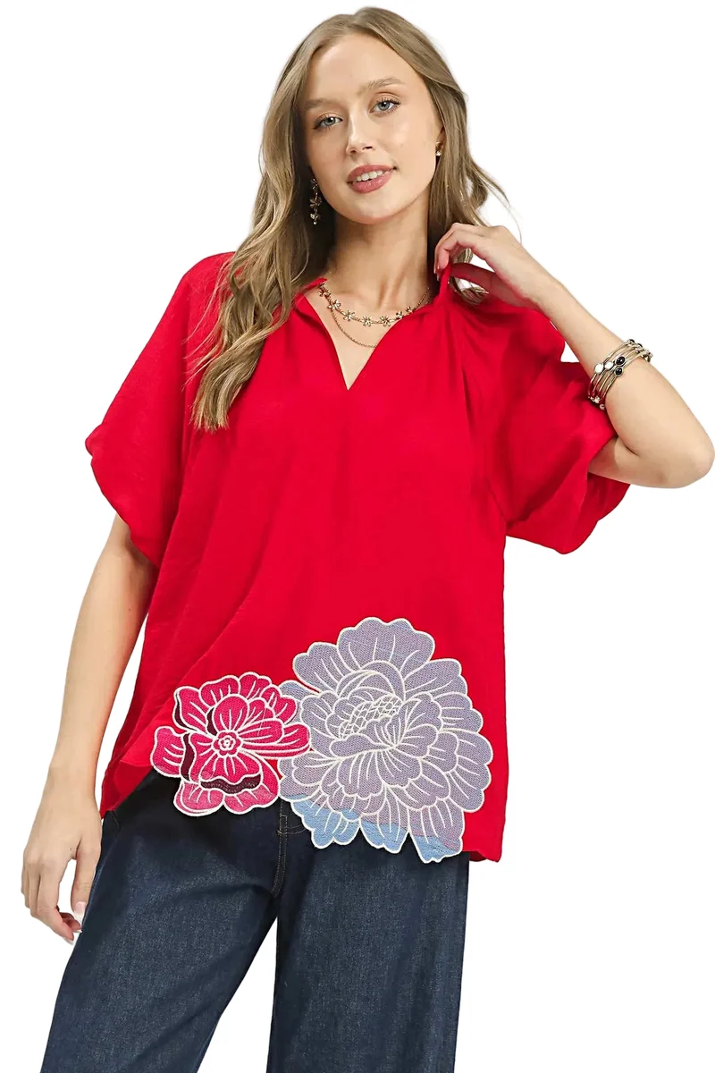 Blouse met geborduurde bloemen aan de zoom