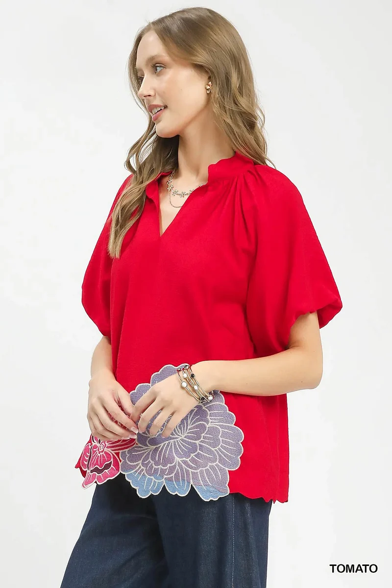 Blouse met geborduurde bloemen aan de zoom