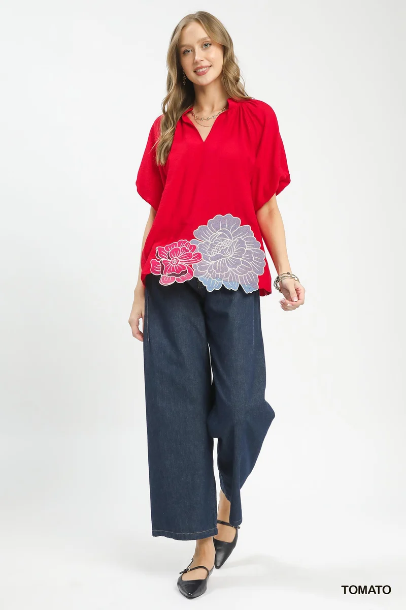 Blouse met geborduurde bloemen aan de zoom