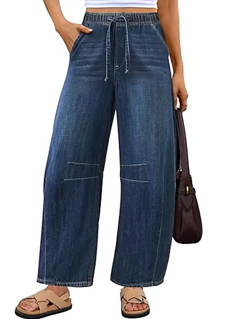 Luxe jeans met elastische tailleband, wijde pijpen, trekkoord en zakken.