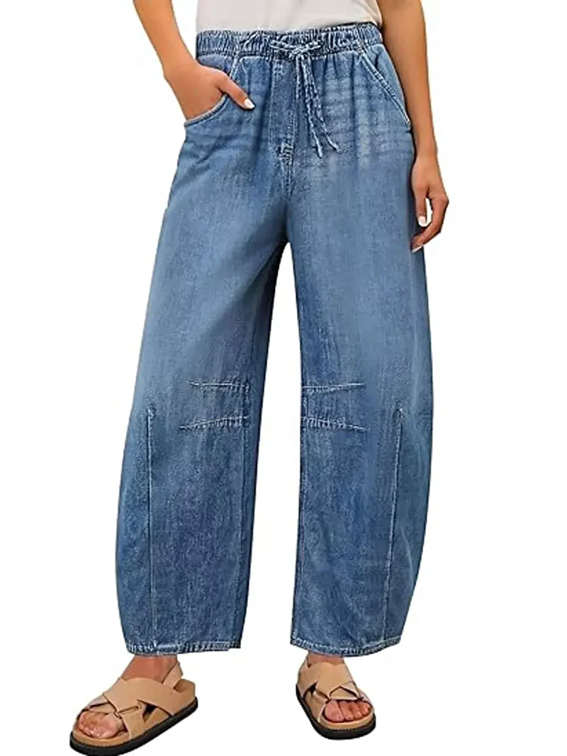 Luxe jeans met elastische tailleband, wijde pijpen, trekkoord en zakken.