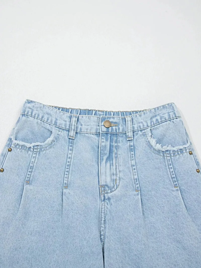 Luxe jeans met studs, zijsplitten, gerafelde zoom en wijde pijpen met zakken.