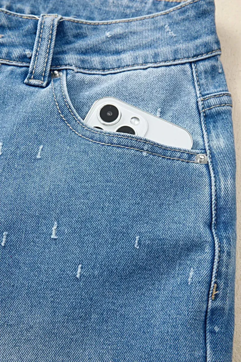 Stijlvolle jeans met een verwassen look, buikcorrigerend effect, rafelige zoom en functionele zakken.