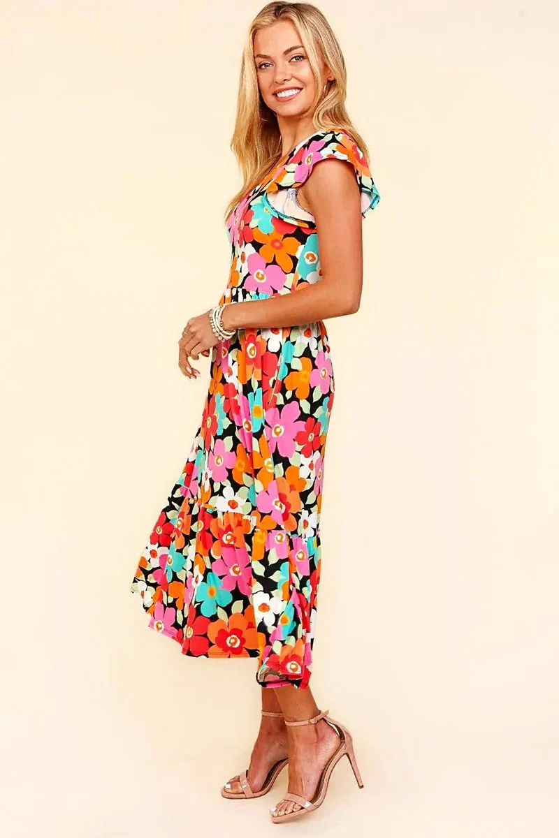 Elegante midi-jurk met bloemenprint en zakken – perfect voor casual of feestelijke gelegenheden in de lente en zomer.