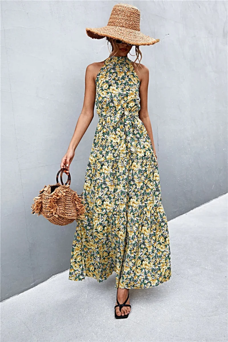 Griekse maxi-jurk met print, strikceintuur, mouwloos ontwerp en stippenpatroon.