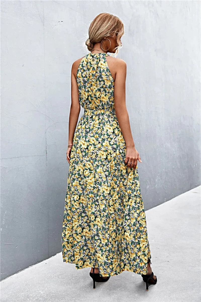 Griekse maxi-jurk met print, strikceintuur, mouwloos ontwerp en stippenpatroon.