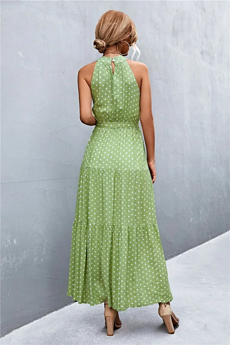 Griekse maxi-jurk met print, strikceintuur, mouwloos ontwerp en stippenpatroon.
