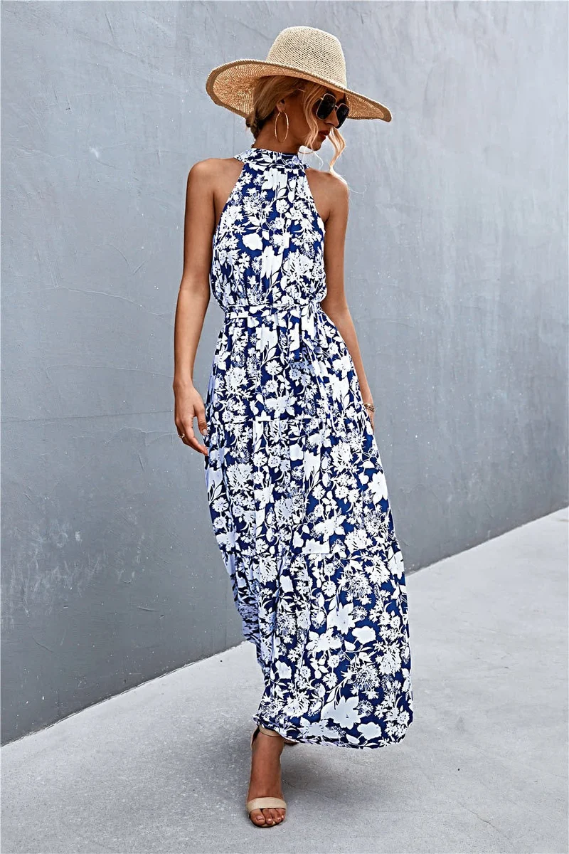 Griekse maxi-jurk met print, strikceintuur, mouwloos ontwerp en stippenpatroon.