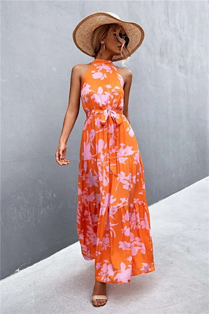 Griekse maxi-jurk met print, strikceintuur, mouwloos ontwerp en stippenpatroon.