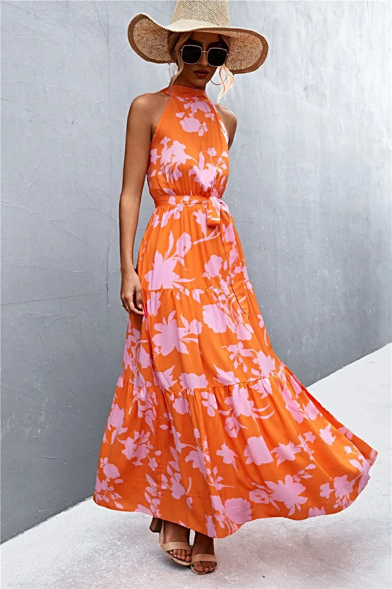 Griekse maxi-jurk met print, strikceintuur, mouwloos ontwerp en stippenpatroon.