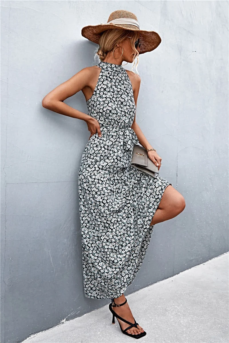 Griekse maxi-jurk met print, strikceintuur, mouwloos ontwerp en stippenpatroon.
