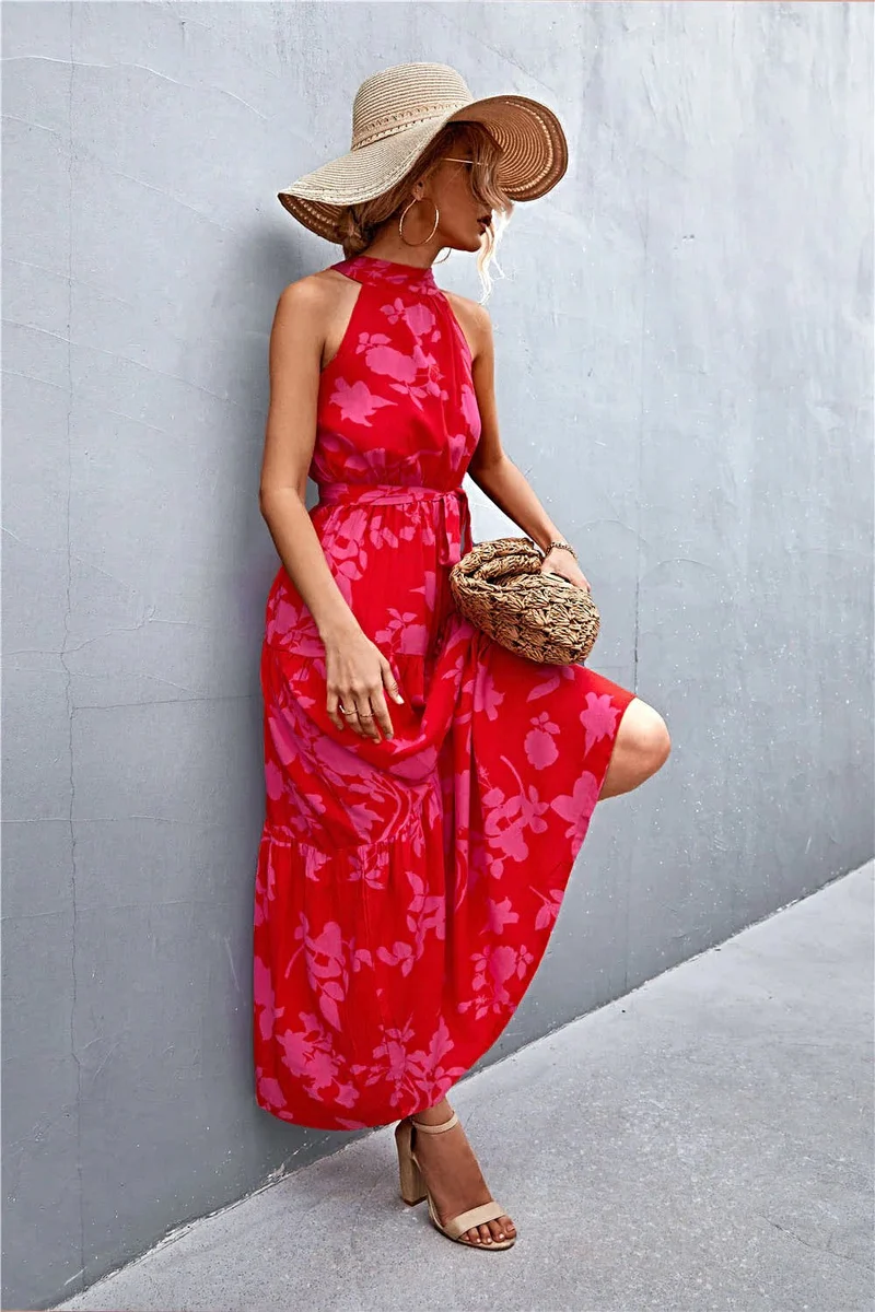 Griekse maxi-jurk met print, strikceintuur, mouwloos ontwerp en stippenpatroon.