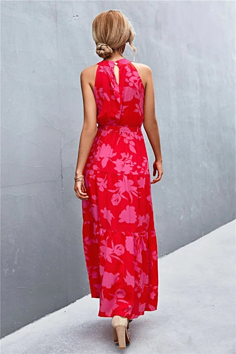 Griekse maxi-jurk met print, strikceintuur, mouwloos ontwerp en stippenpatroon.