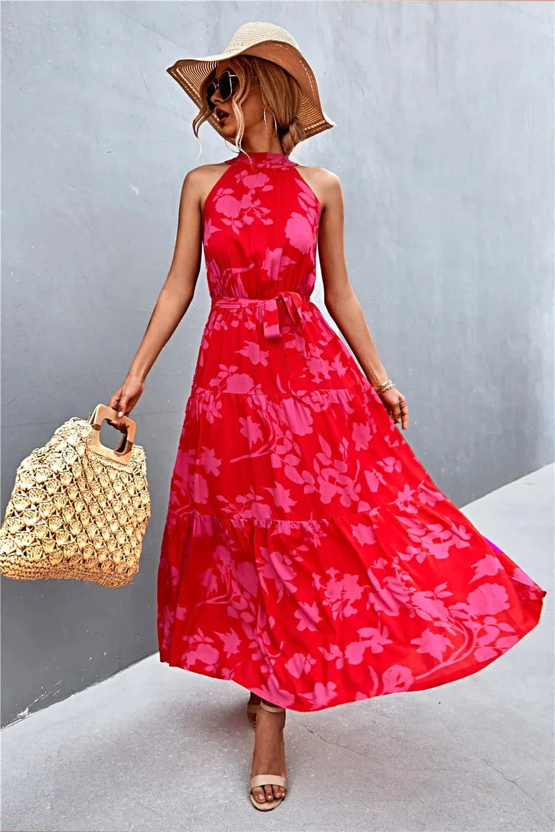 Griekse maxi-jurk met print, strikceintuur, mouwloos ontwerp en stippenpatroon.