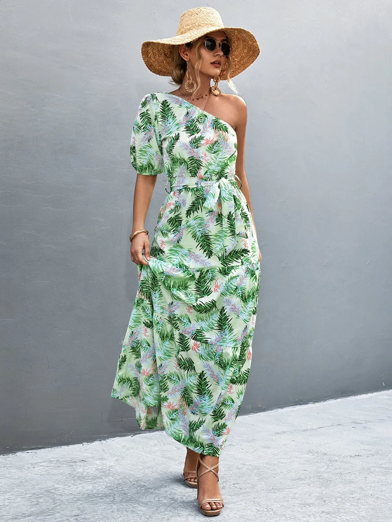 S-XL • Maxi-jurk met één schouder • Bedrukt A-lijn model • Strikceintuur • Ballonmouwen
