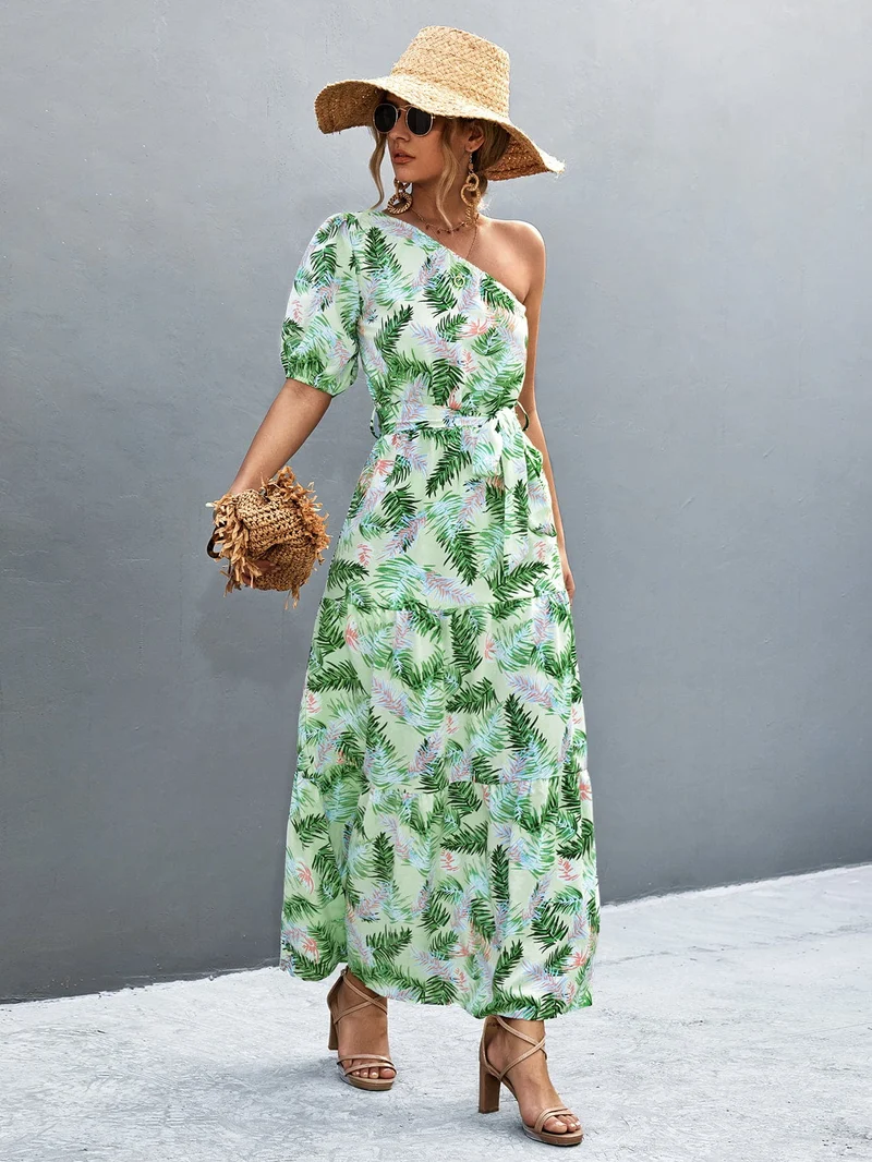 S-XL • Maxi-jurk met één schouder • Bedrukt A-lijn model • Strikceintuur • Ballonmouwen
