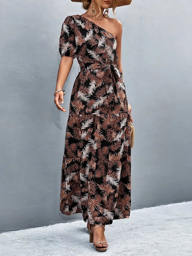 S-XL • Maxi-jurk met één schouder • Bedrukt A-lijn model • Strikceintuur • Ballonmouwen