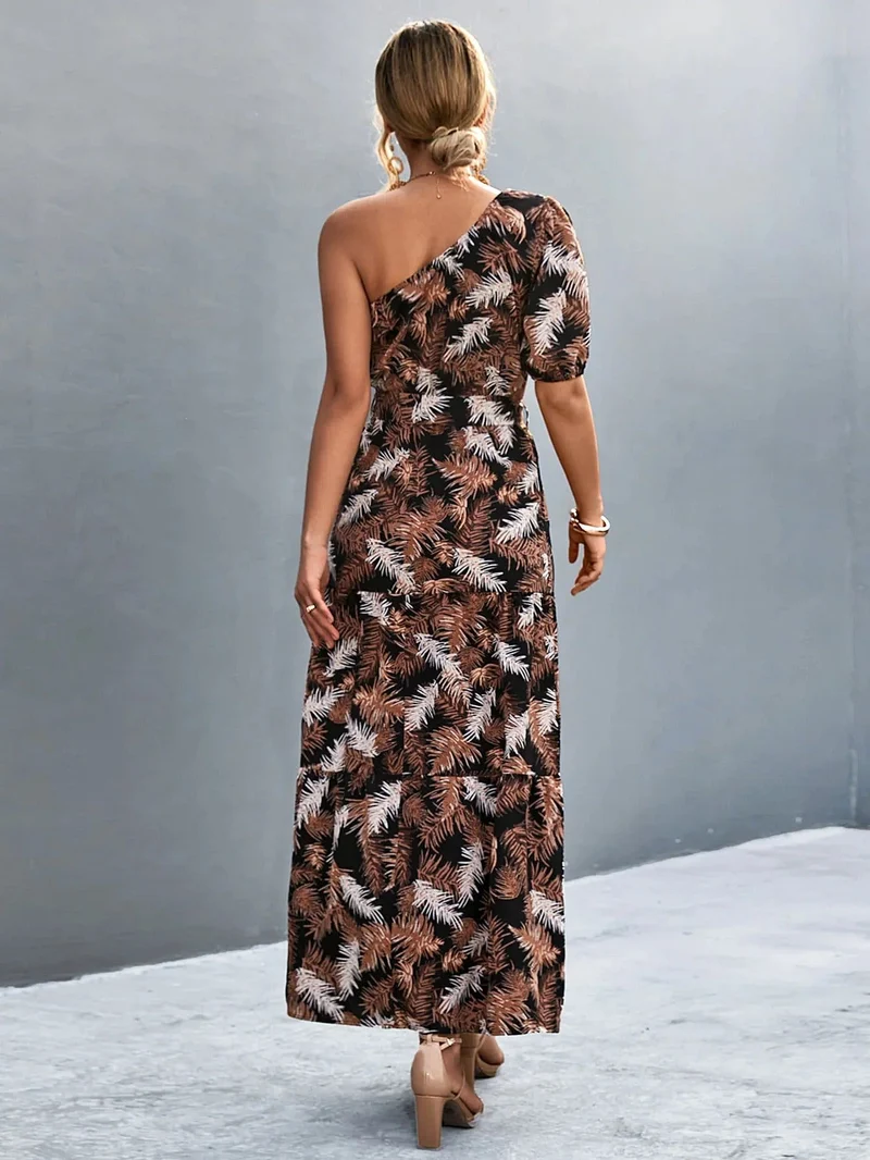 S-XL • Maxi-jurk met één schouder • Bedrukt A-lijn model • Strikceintuur • Ballonmouwen