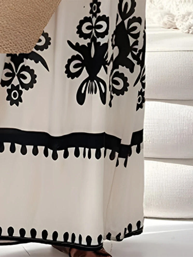 Elegante maxi-jurk met print en spaghettibandjes, zonder mouwen - de perfecte maxi-jurk voor de zomer.