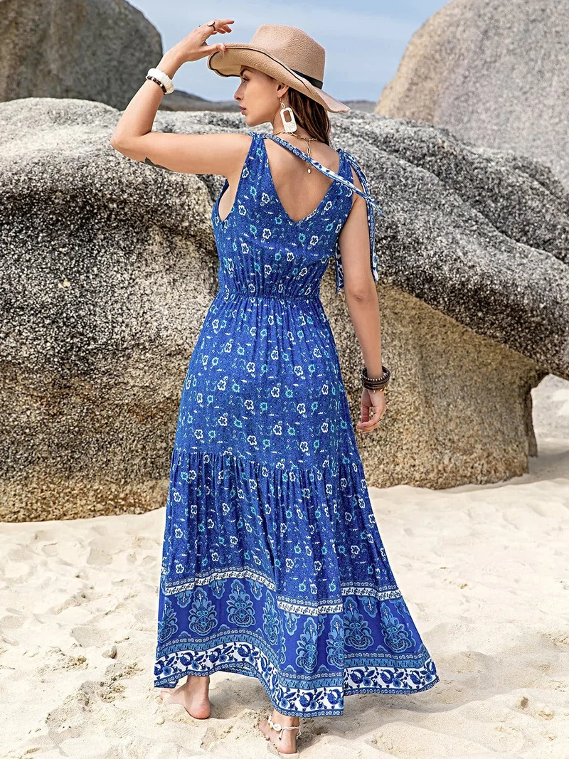 Zomerse casual jurk met bloemenprint, V-hals en strikdetails op de schouders, ondoorzichtige viscose.