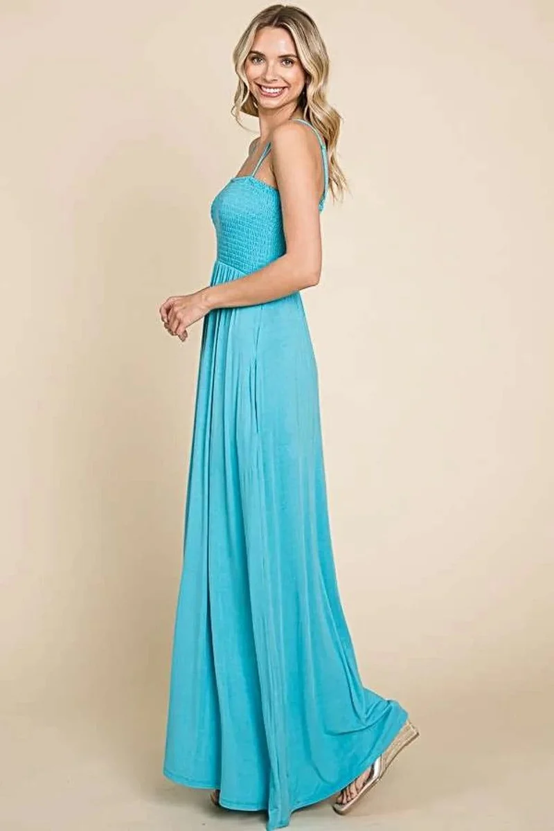 Elegante maxi-jurk met smockwerk en zakken - flatterende pasvorm en zwierige stijl.