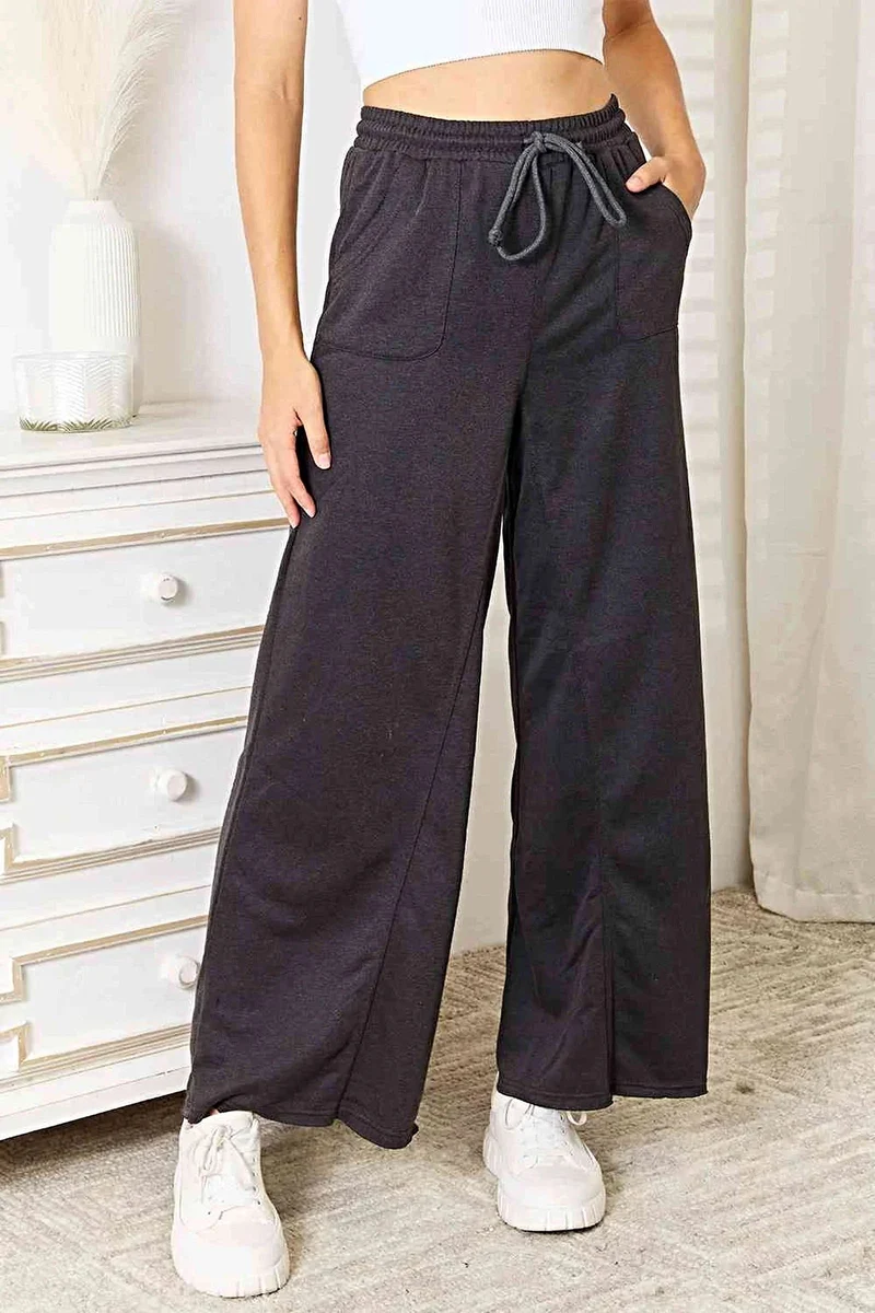 Chique broek met wijde pijpen en zakken voor moeiteloze elegantie - ondoorzichtige stof en veelzijdige stijl.