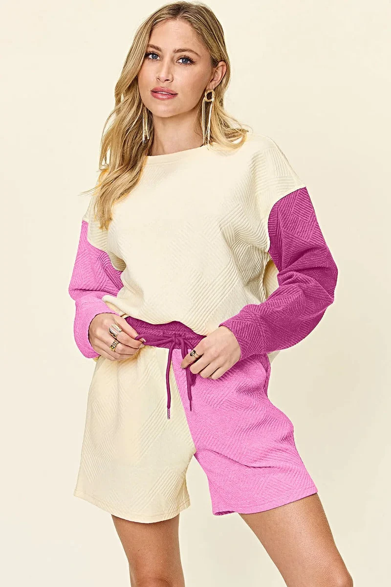 Luxe tweedelige set met short, zakken en top met verlaagde schouders.