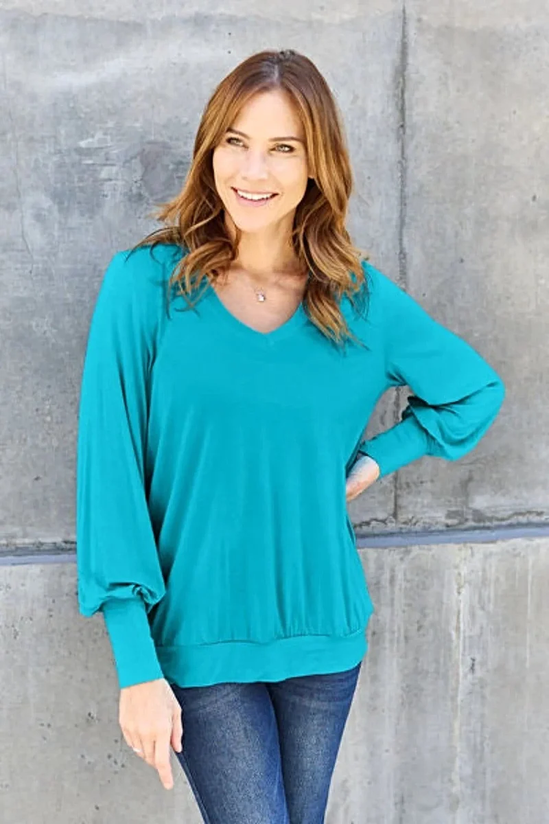 Luxe basic top met V-hals en pofmouwen - Licht elastische, ondoorzichtige blouse voor een moeiteloze stijl.