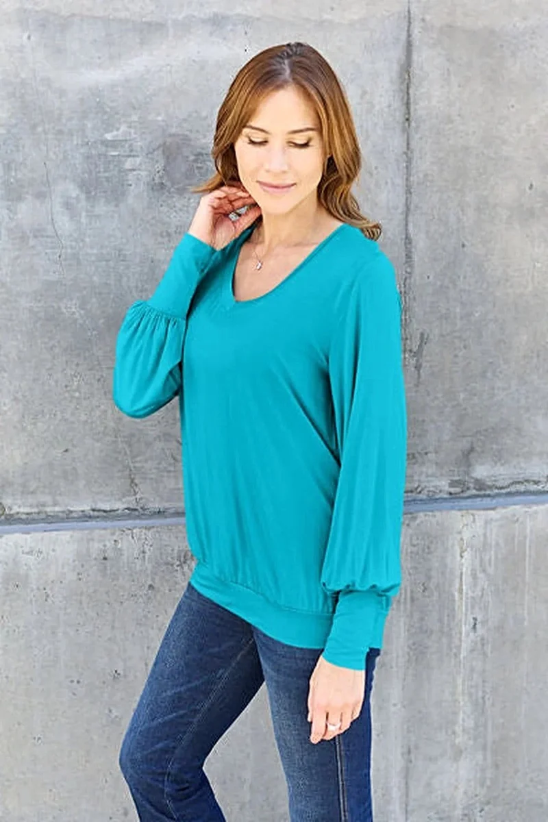 Luxe basic top met V-hals en pofmouwen - Licht elastische, ondoorzichtige blouse voor een moeiteloze stijl.