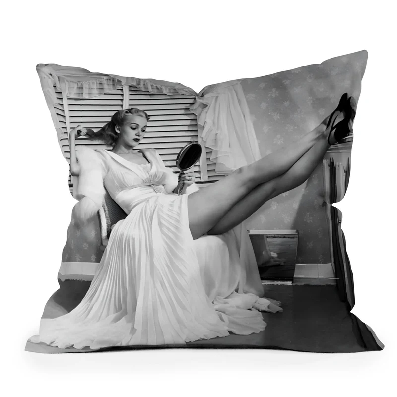 1939 the blonde bombshell movie actress Carole Landis as she brushes in mirror vintage photograph Throw Pillow