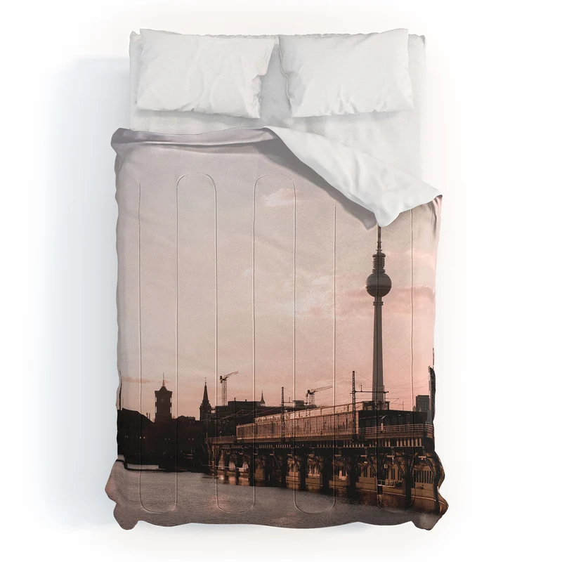 Berlin Germany I Fernsehturm television tower and Spree river at sunset in a pastel pink sky Comforter
