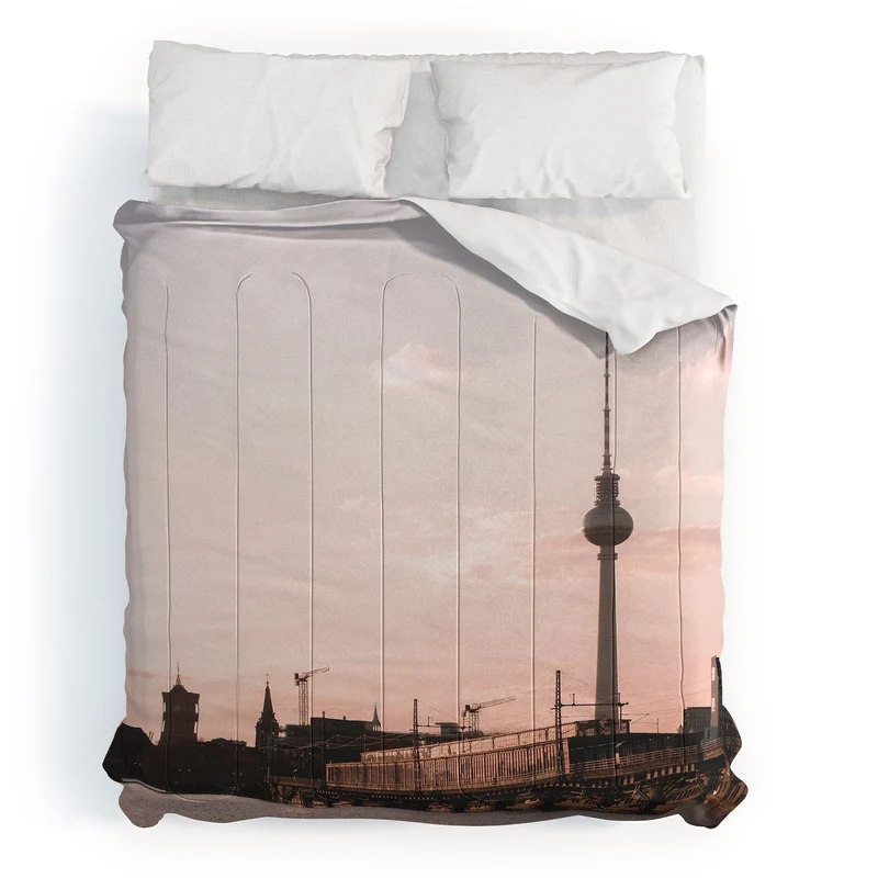 Berlin Germany I Fernsehturm television tower and Spree river at sunset in a pastel pink sky Comforter
