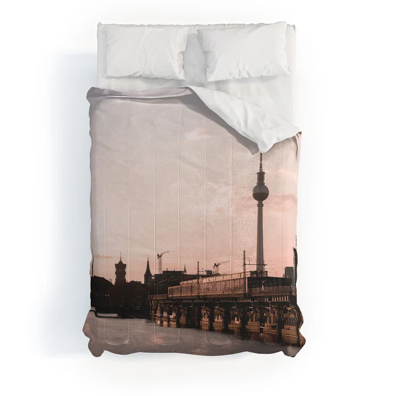 Berlin Germany I Fernsehturm television tower and Spree river at sunset in a pastel pink sky Comforter