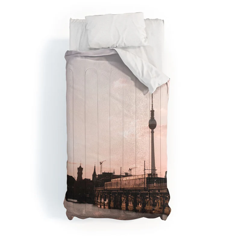 Berlin Germany I Fernsehturm television tower and Spree river at sunset in a pastel pink sky Comforter