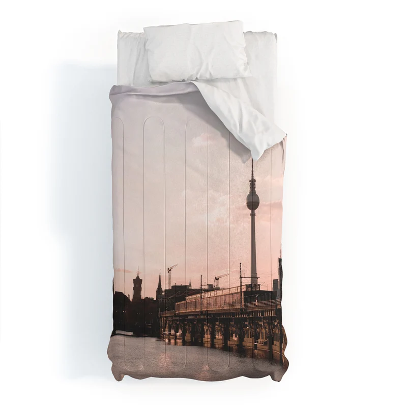 Berlin Germany I Fernsehturm television tower and Spree river at sunset in a pastel pink sky Comforter
