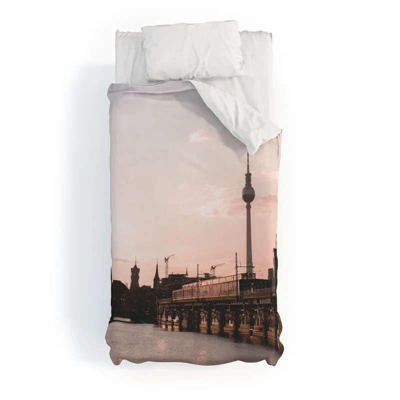 Berlin Germany I Fernsehturm television tower and Spree river at sunset in a pastel pink sky Duvet Cover