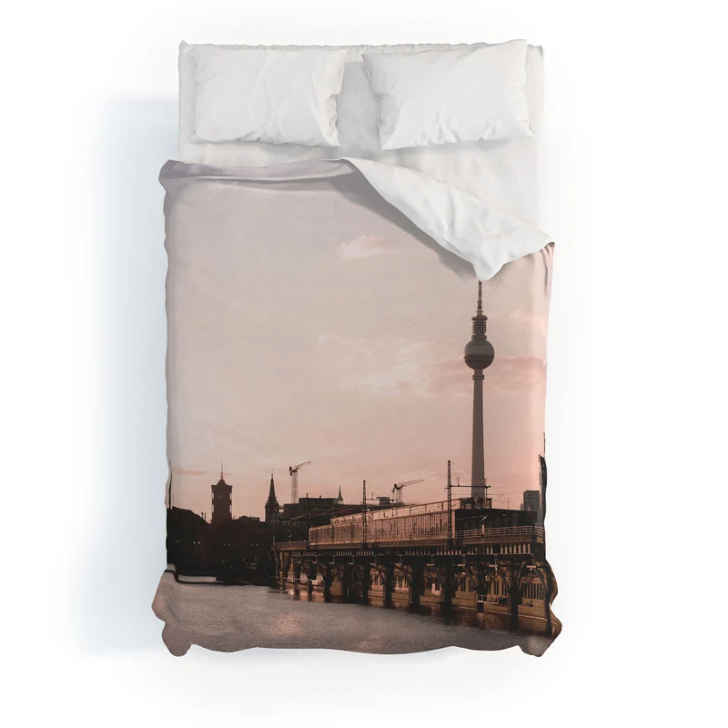 Berlin Germany I Fernsehturm television tower and Spree river at sunset in a pastel pink sky Duvet Cover