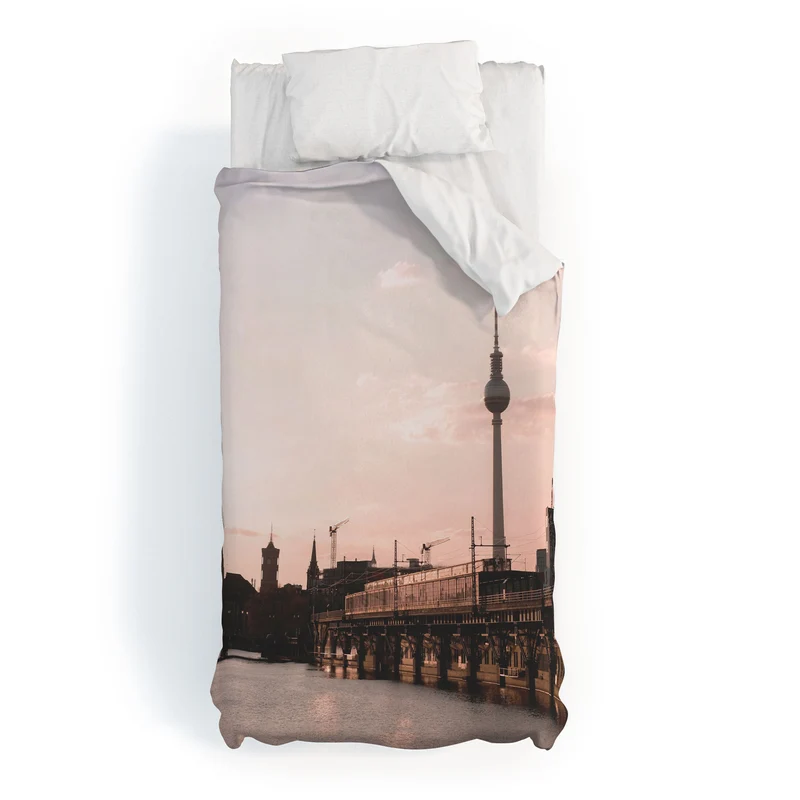 Berlin Germany I Fernsehturm television tower and Spree river at sunset in a pastel pink sky Duvet Cover