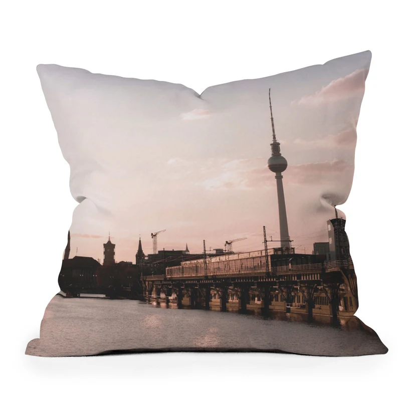 Berlin Germany I Fernsehturm television tower and Spree river at sunset in a pastel pink sky Throw Pillow