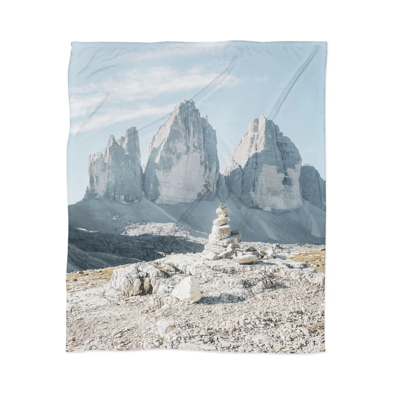 Dolomites Italy I Stone cairn in front of Tre Cime di Lavaredo peaks in the Italian Alps mountains Throw Blanket